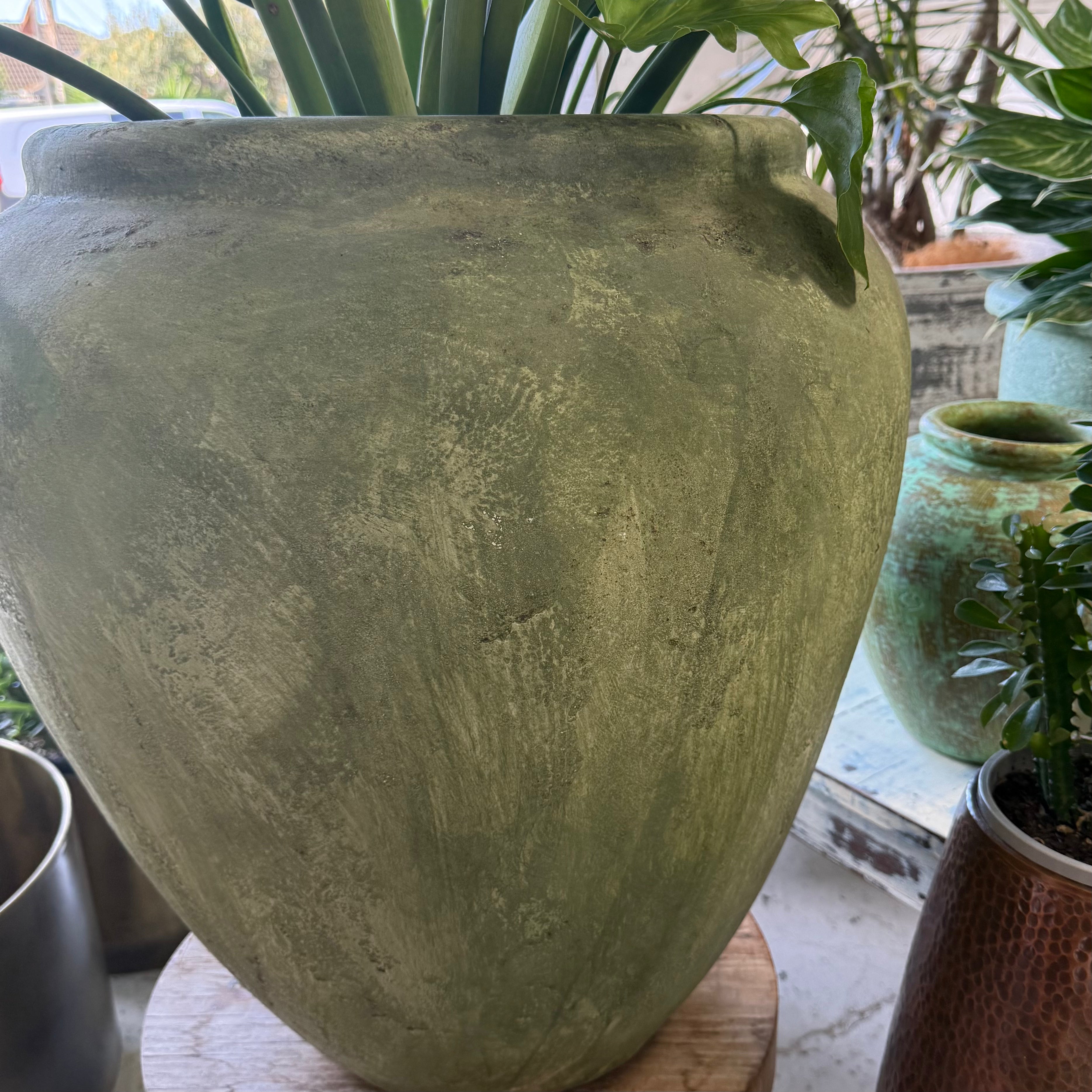Green whitewashed urn