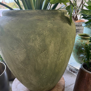 Green whitewashed urn